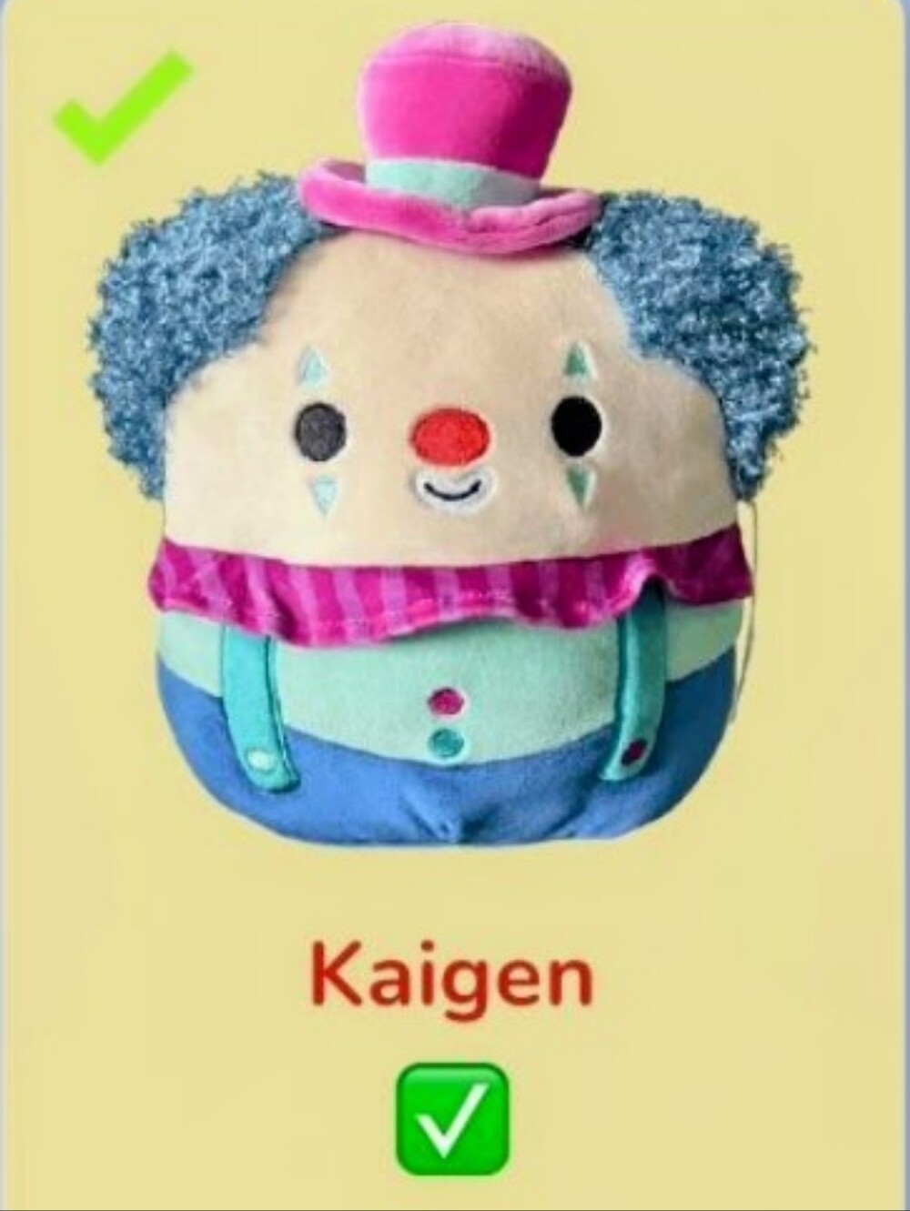 Squishmallows plush, Kaigen the Clown, identified by his blue, teal, and pink